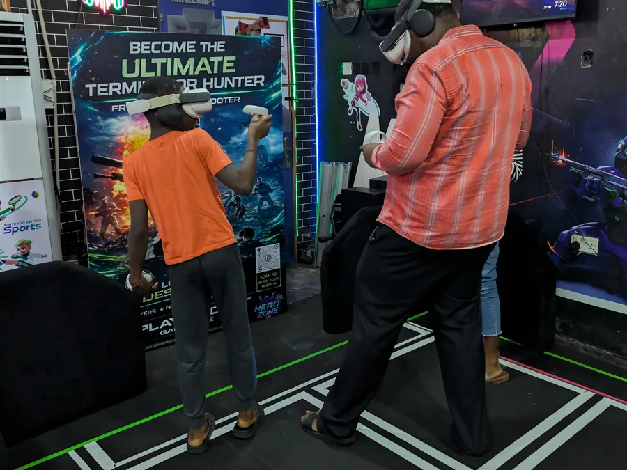Family group sharing a VR arena session at Player One Game Cafe