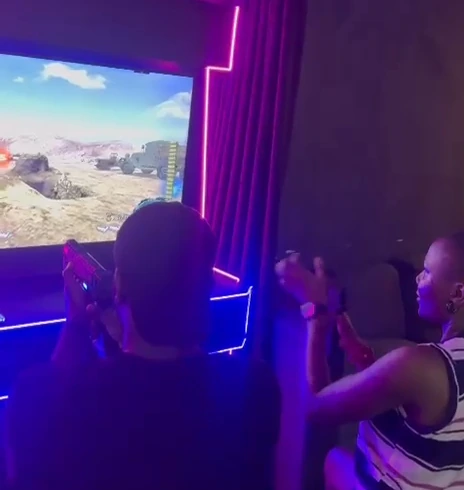 Two players using the Player One light-gun arcade cabinet.