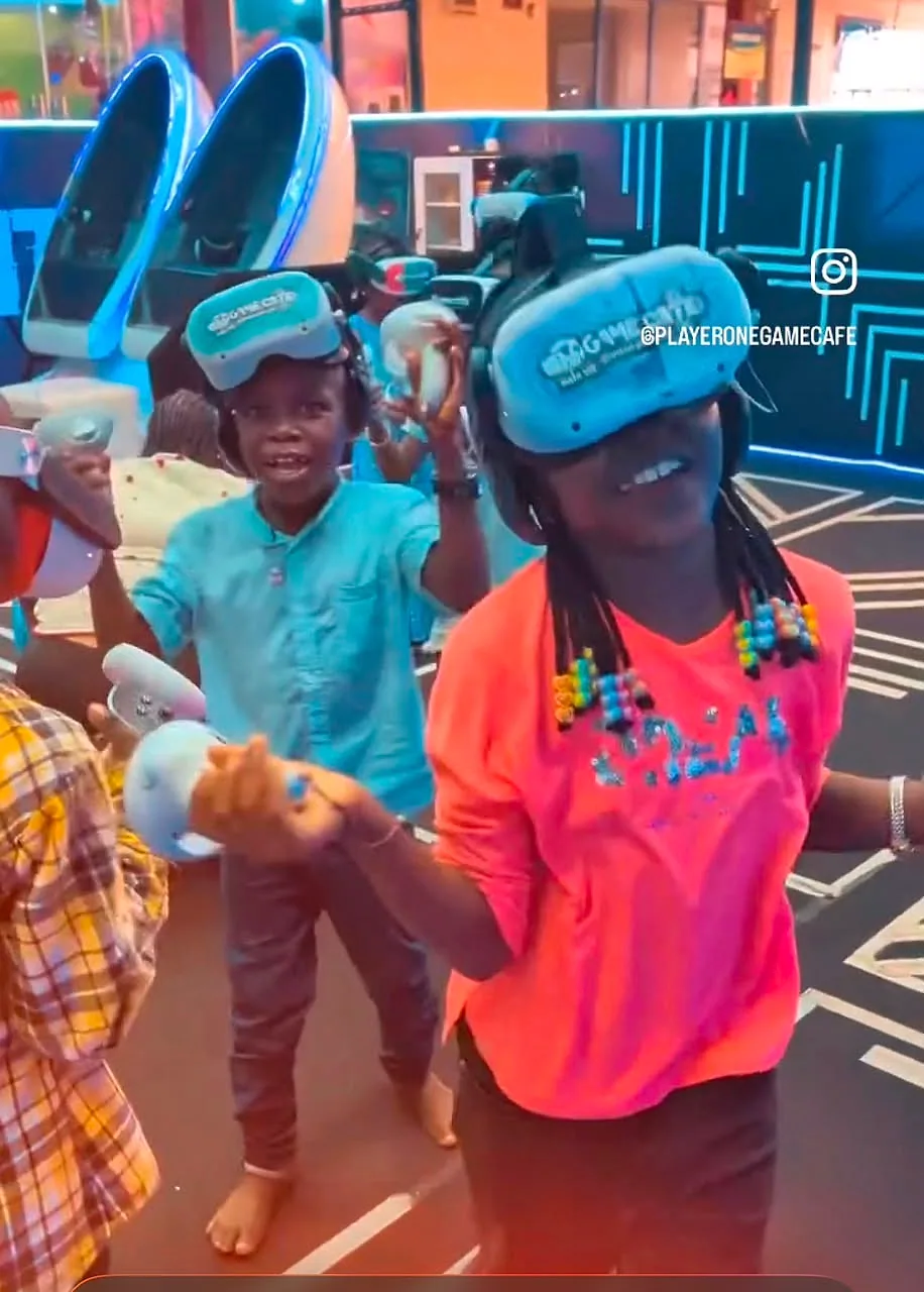 Children smiling and playing virtual reality at Player One GameEdu