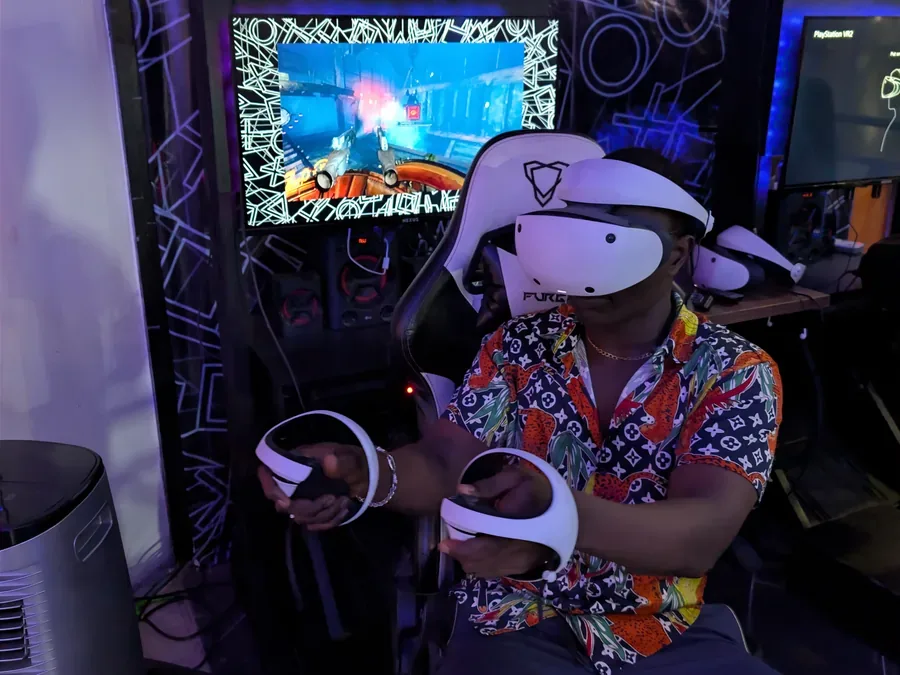 Player using PlayStation VR2 style headset experience at Player One Game Cafe