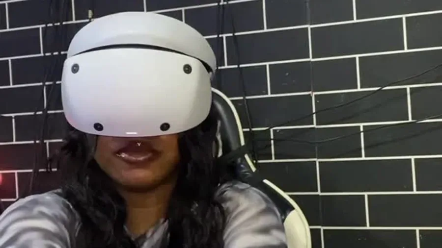 A smiling Player One guest reacting during a real VR session