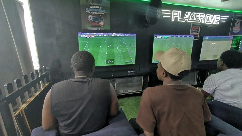 Friends playing FC football in the Player One PS5 gaming lounge