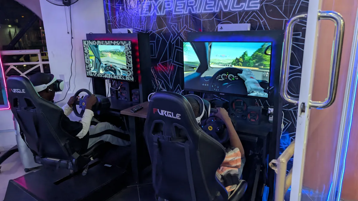 Gaming event and dual racing simulator moment at Player One Game Cafe Victoria Island